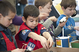 Cub scouts making bird feeders