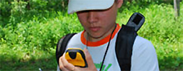Boy looking at GPS unit