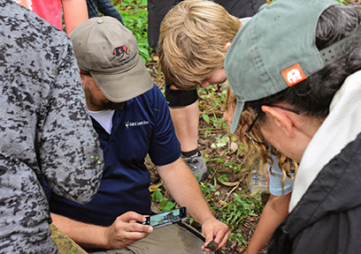Members of the public and Saint Louis Zoo staff identify a species