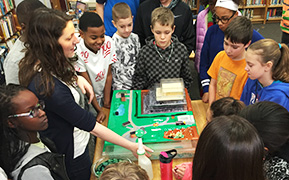 Students with landfill model