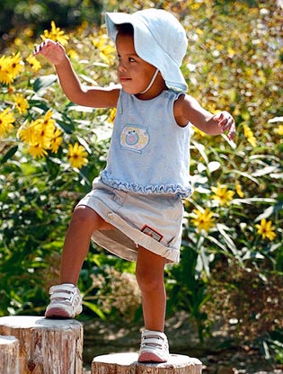 Girl climbing in Children's Garden