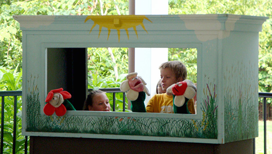 Kids playing with puppets