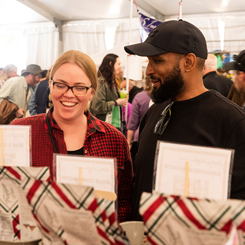 Couple shopping under large tent