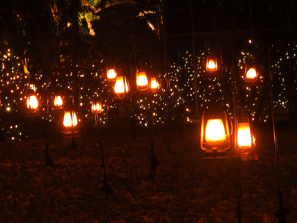 Glowing lanterns hanging in asymmetrical patterns