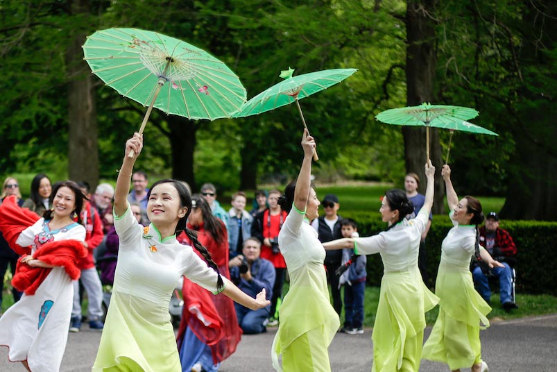 Chinese acrobatic dancers performing on a Garden plaza