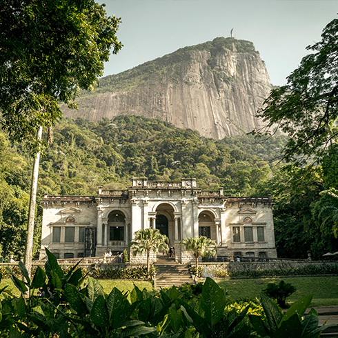 Historic mansion with mountain in background
