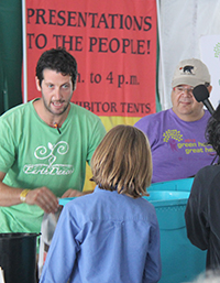 Vermacomposting speaker engages with audience member at 2013 Festival