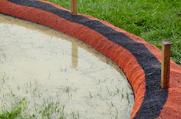 Compost sock dam holding rainwater