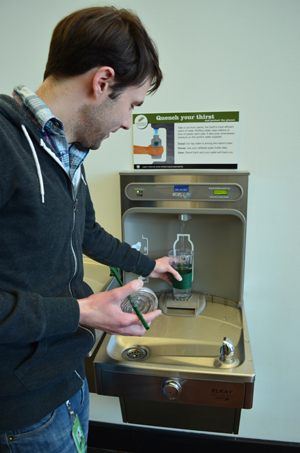 Refilling water bottle at a hyrdration station