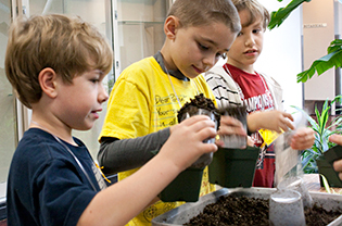 Students planting during a Garden class