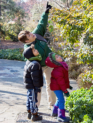 Instructor and kids looking for birds