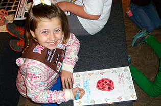 Brownie drawing a ladybug