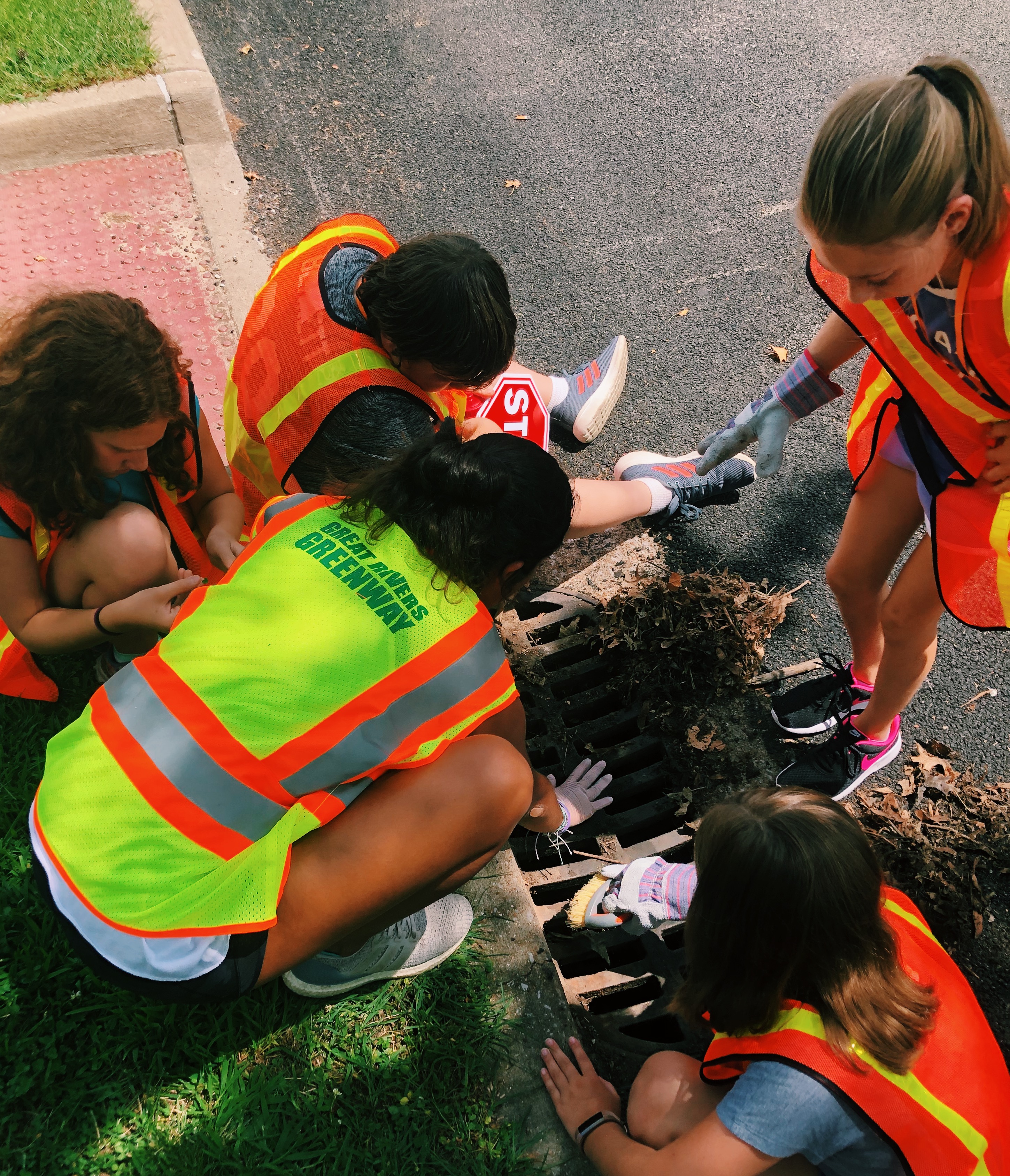 Students marking a storm drain