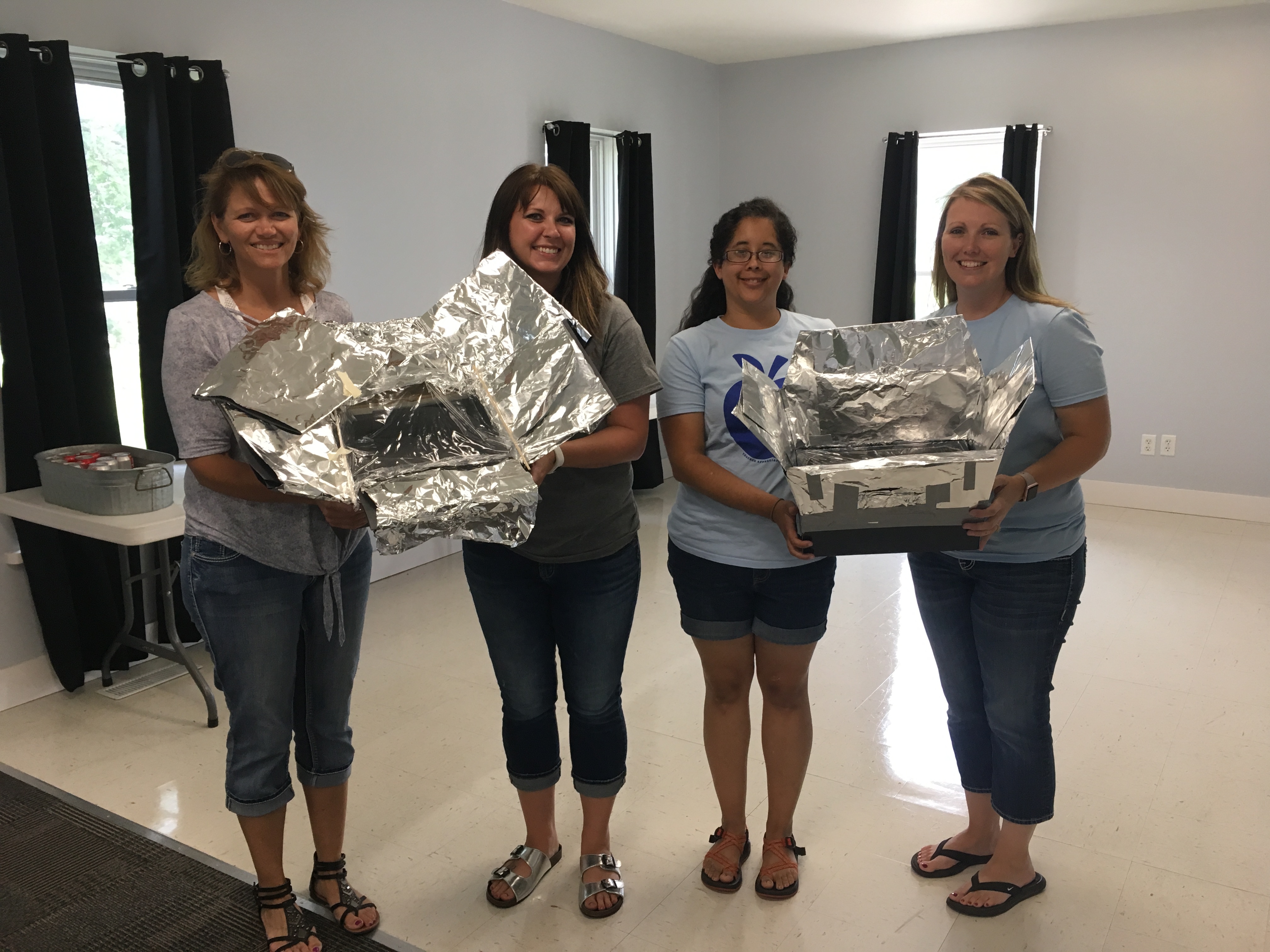 Teachers with solar ovens