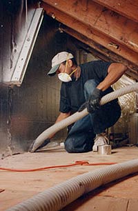 Contractor sealing the attic